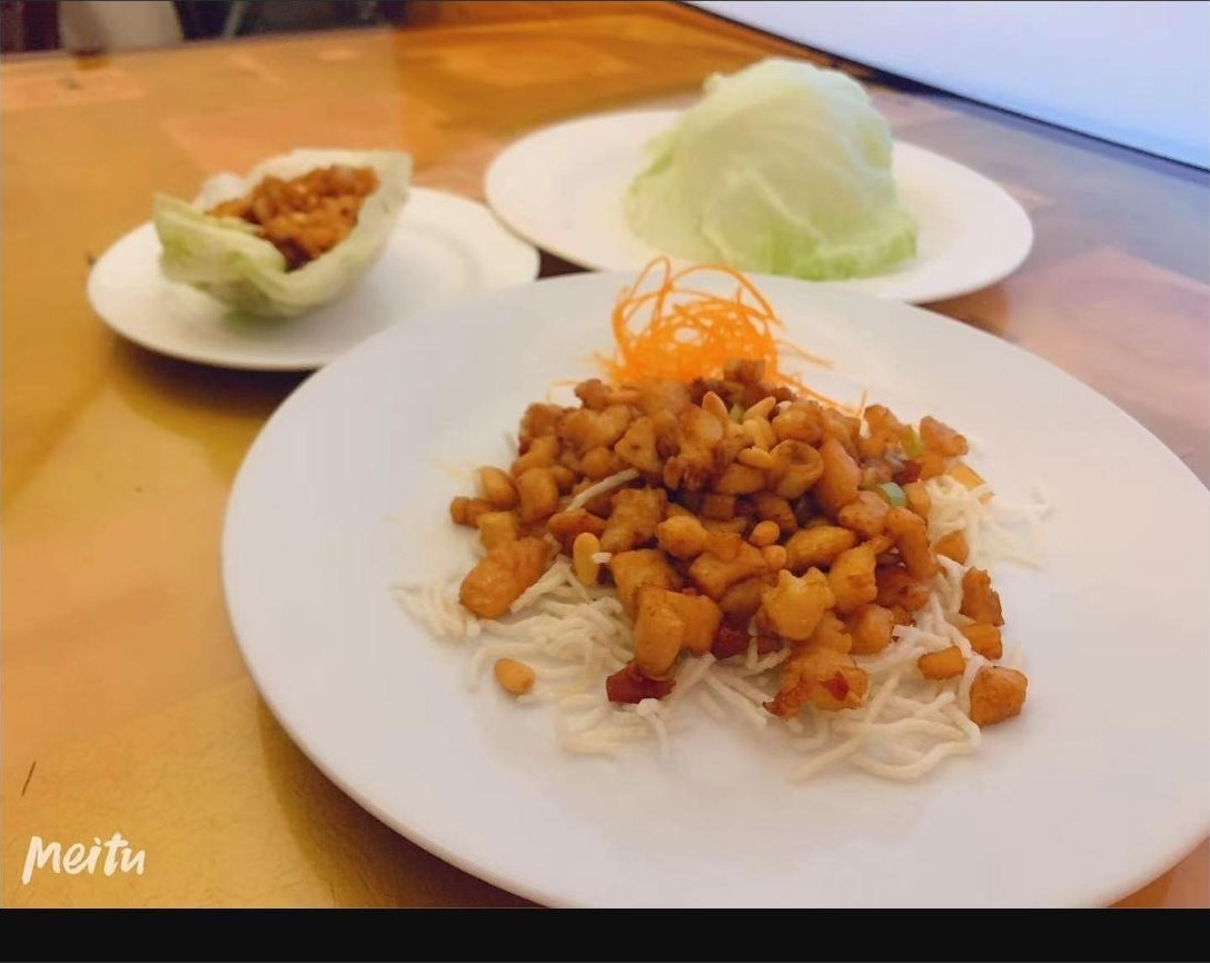 Concerto signature lettuce wraps presented on a white plate