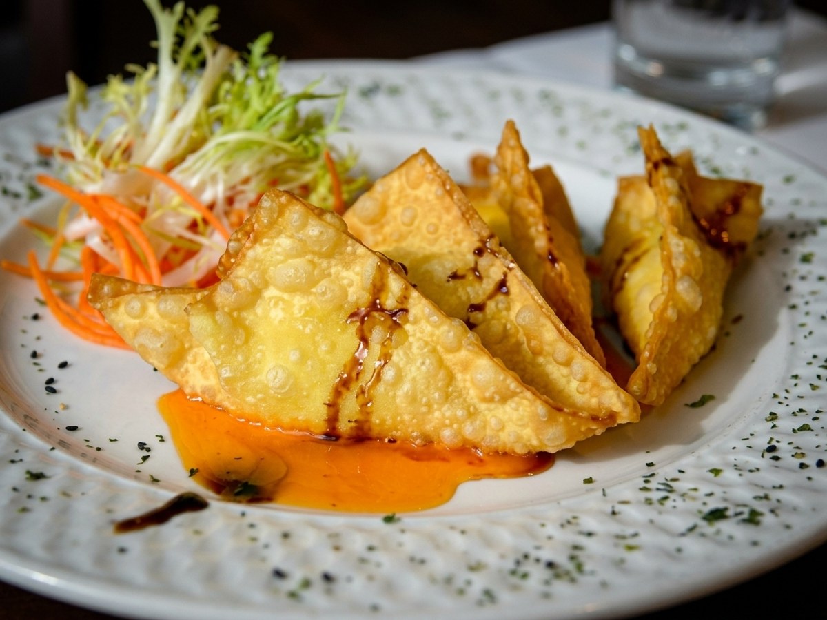Golden crispy Crab Rangoon served with coconut dressing